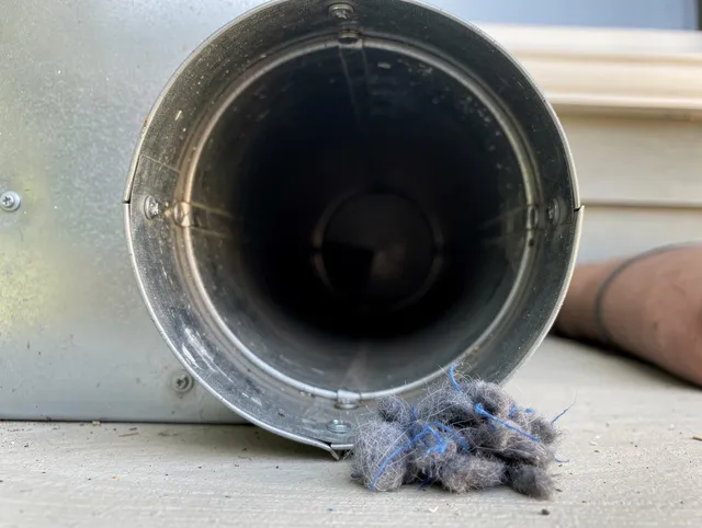 Waterford Dryer Vent Cleaning technician using specialized equipment to clear severe dryer vent blockage in Waterford